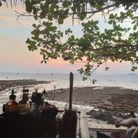 Sunset at low tide from lying down area at Benny's On The Beach in Koh Lipe