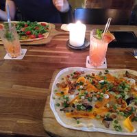 From top left: flammkuchen with pumpkin, blood orange lemonade, and with mushrooms at Mokel Bar in Muenster