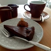 Chocolate cake and coffee with homemade almond milk at Mandlove Srdco in Bratislava