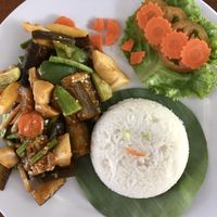 Stir fried eggplant with rice (the owner’s daughter added a smiley face to the rice)  at Bar Ang in Battambang