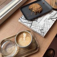 Coffee with oat milk and chocolate and peanut butter cookie  at Hummingbird in Amsterdam