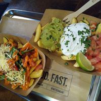 With bolognese sauce (top) and guacamole&sour cream&tomatoes (bottom) - all vegan! at Frittenwerk - Ehrenstraße in Cologne