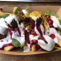 French fries with pink hummus and falafel  at Frittenwerk - Ehrenstraße in Cologne