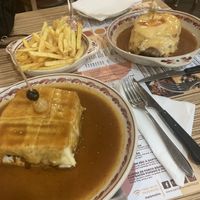 Vegan franceshina on the left  at Santa Francesinha in Porto