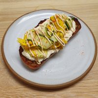 Lemony courgette ribbons on homemade almond "cheese" at Bread By Bike in North London