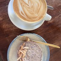 Vegan cheesecake and latte.  at The Garden Café in Granada