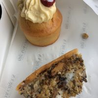 Vegan cupcake and amazing mushroom and rosemary vegan quiche. (Sorry there’s only half of it - I couldn’t wait!!).  at Born & Bread in Daventry