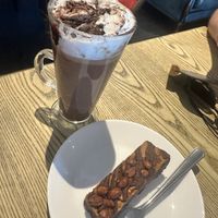 Oat hot chocolate with vegan whip and a vegan peanut butter brownie   at Suzie's Cup of Joy in Cleethorpes