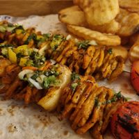 Chicken skewer at Hummus Bar in Haifa