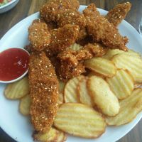Shnitzelonim and fries at Hummus Bar in Haifa
