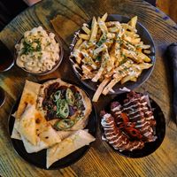 Mac N Chz (top left) garlic butter fries (top right) winter hummus & flatbread (bottom left) Kentucky wings Korean BBQ flavour (bottom right) at BA-HA in Birmingham