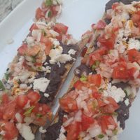 Vegan molletes with almond cheese at Orgánico in Merida
