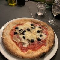 Margarita pizza with olives, onion, mushrooms plus melty vegan cheese and vegan Parmesan shavings at Peter Pizzeria in Loughborough