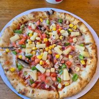 A really nice, vegan pizza. Just the right size and perfectly cooked. Loads of toppings on it. at Great White Pizza in Panama City Beach