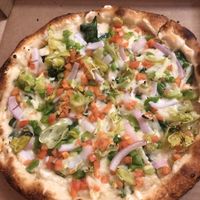 Vegan Daiya cheese. Did the build it yourself option. (Spinach, tomatoes, onion, green peppers, olive oil and garlic)    at Great White Pizza in Panama City Beach