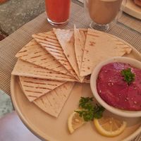 Beetroot-Hummus with Bread, Watermelon Mango Juice and Latte Macchiato with Oatmilk at Smooth Cafe in Moalboal