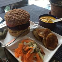 Vegan burger, with veg, potato chip and soup at Travel Yoga Cafe in New Delhi