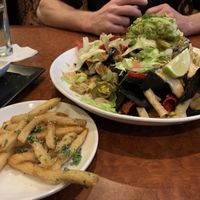 Vegan nachos and truffle fries at CRAVE in Maple Grove