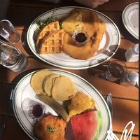 Waffles and schnitzel (top) and the American (bottom) at Hinterhof in Los Angeles