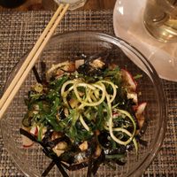 Bowl with zoodles, reddish, nori leaves, wakame, macadamia, smoked tofu, edamame at Local in Lisbon
