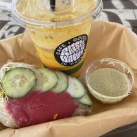 Island Spring Rolls (there were 2 rolls, I ate one already!) served with yummy sauce. Iced Golden Milk!  at Raised by the Waves  in Kahuku