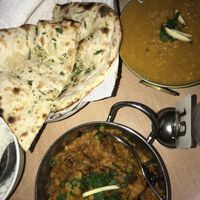 Eggplant massala (bottom), dahl tadka (top) and garlic naan. HEAVENLY at Sabi's Kitchen in Port Douglas