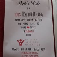 Their non-profit activity at Mark's Cafe in Varanasi