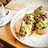 Smashed avocado 🥑 on sourdough toast with a coconut latte  at Jaunty Goat Coffee - Northgate St in Chester