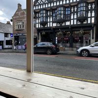 1911 firehouse is the view while you sip on your latte  at Jaunty Goat Coffee - Northgate St in Chester