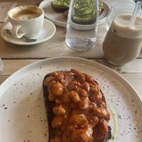 Boston beans, avo toast, iced coconut latte and oat flat white  at Jaunty Goat Coffee - Northgate St in Chester