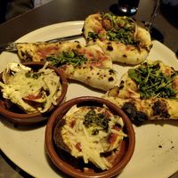 Vegan nachos with mushrooms and veganised pizza Sur at Tango in Granada