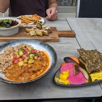 The hummus with seed bread and the potatoes are so good! at Stem & Glory in London