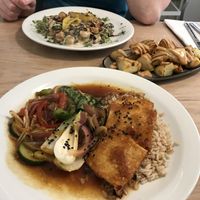 Gnocchi in the background, potatoes in the centre, baked tofu yakitori in front  at Stem & Glory in London