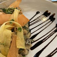 Swede gnocchi with roasted chestnut mushroom & spinach in ‘gorgonzola’ cream with spiced walnuts, aged balsamic, yellow carrot curls & micro sage.  at Stem & Glory in London