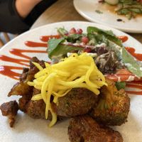 Bang Bang broccoli toasted in sweet & spicy sauce served with on sunshine salad & topped with spring onion   at Stem & Glory in London