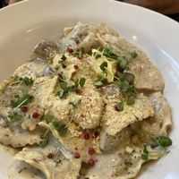 Pumpkin ravioli served with sage butter sauce & house made cashew parmesan  at Stem & Glory in London
