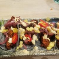 Jackfruit tacos on blue corn tortillas at Stem & Glory in London