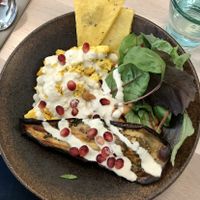 Chickpea, tofu, eggplant curry with polenta wedges at Stem & Glory in London
