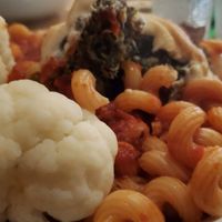 Corkscrew pasta with Quinoa Ball topped with Vegan cheese, served with steamed cauliflower at Mezzo Italiano in Cambria