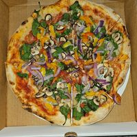 Red sauce, vegan mozzarella, mushroom, spinach, bell pepper, onion at Freak Brothers Pizza in Phoenix