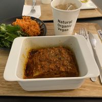Lasagna set comes with 2 salads and a drink. This is kale and carrots salads with homemade ginger ale    at HND - HealthyTOKYO Cafe & Shop - T2 in Tokyo