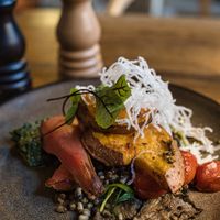 Oven-baked sweet potato with mung beans, kale pesto, mushrooms, pear at Rataskaevu 16 in Tallinn