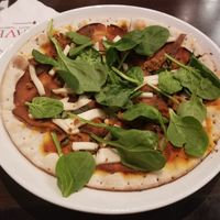 Vegan meat lovers pizza with added spinach at CRAVE in Roseville