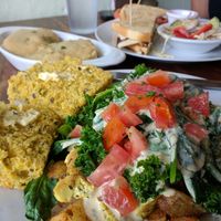 Widower potatoes with tofu, cornbread, and a half order of biscuits and gravy. Happy Waitress sandwich in background. at Wildflower Cafe and Bakery in Arcata