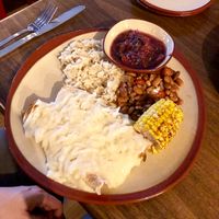 Vegan enchiladas with roasted vegetable filling and covered in vegan cheese.  at Bolos Kitchen in Brunswick