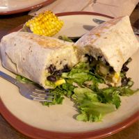 Roasted vegetable burrito with vegan cheese at Bolos Kitchen in Brunswick