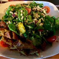 Vegan St. Stephen’s salad with added falafel. It’s a spinach salad, with roasted cauliflower, quinoa, couscous, tomatoes, banana peppers, red onion, with avocado dressing. at Guyutes in Oklahoma City