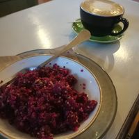 Beetroot quinoa salad with flat white in background at Munch in Palmerston North