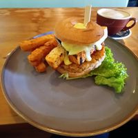 Mushroom tofu bagel with hollandaise and hash stack. Full vegan. Soy latte ❤️ at Munch in Palmerston North
