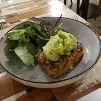 Corn cake with guac & side salad. at Munch in Palmerston North